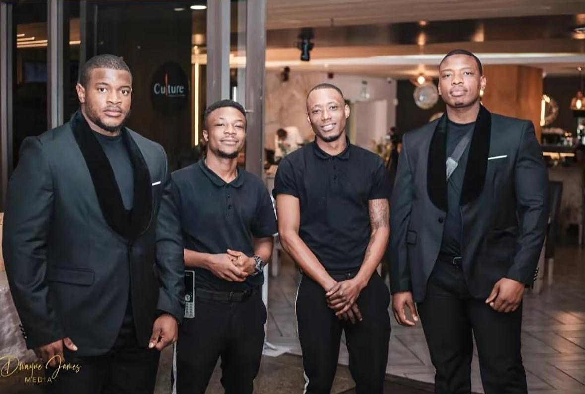 KM VIP Protection team in black suits at upscale event venue